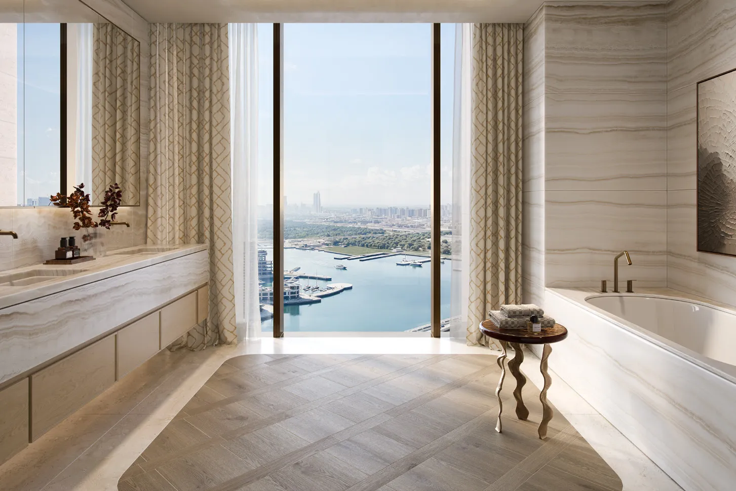 Marble bathroom with freestanding tub and tall window over the marina